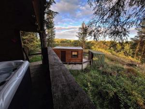 a small cabin in the middle of a field at Ty Grug Retreat in Little Newcastle