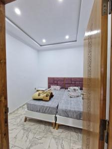 Ліжко або ліжка в номері Résidence Kelibia