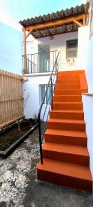 a set of stairs leading to a building at Upstairs Home in Ponta Delgada