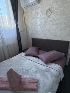 Postel nebo postele na pokoji v ubytování Ama House