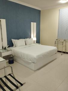 Postel nebo postele na pokoji v ubytování Open Hotel Buraiyda