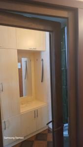 a cabinet with a mirror in a room at Sea Star 2 in Batumi +50 photos