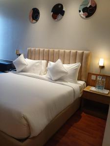 Postel nebo postele na pokoji v ubytování Marrievilla Hotel & Resort