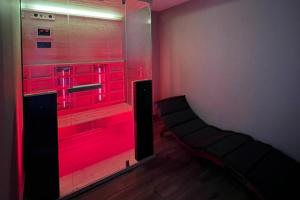 a room with a red lighted walk in closet at Boutique Wine and Wellness Retreat - Wine Residence Kerman in Štrigova