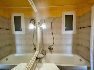 a bathroom with a tub and a mirror at Villa Renata & Magic Suite in Parga +50 photos