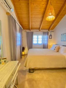 Postel nebo postele na pokoji v ubytování Jenoa, sealight house