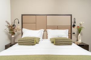 Ένα ή περισσότερα κρεβάτια σε δωμάτιο στο Al Porto Suites - NEW!