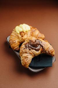 a plate with two croissants with chocolate and marshmallows at Al Porto Suites - NEW! in Novigrad Istria