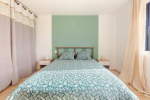 Katil atau katil-katil dalam bilik di Appartement dans villa