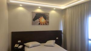 Voodi või voodid majutusasutuse Salma Hotel Cairo toas