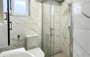 a bathroom with a toilet and a glass shower at Nice Apartment In Crikvenica in Crikvenica