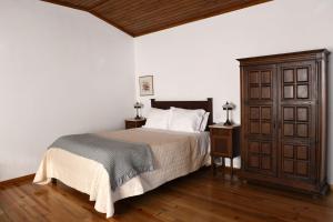 Ένα ή περισσότερα κρεβάτια σε δωμάτιο στο Casa Do Carvalho +28 φωτογραφίες