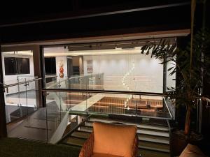 a view of a balcony with a glass floor at Robles Penthouse in San Gil +30 photos