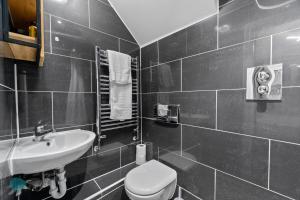 a bathroom with a toilet and a sink at Smeatons by Pureserviced in Plymouth +12 photos