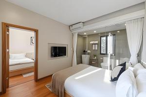 Postelja oz. postelje v sobi nastanitve Gulangyu Liuyue Garden Resort Hotel