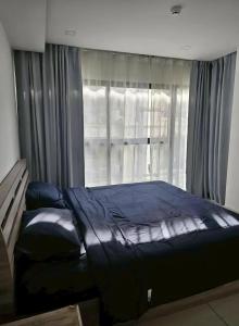 Ένα ή περισσότερα κρεβάτια σε δωμάτιο στο Siam Lucky Star Inn
