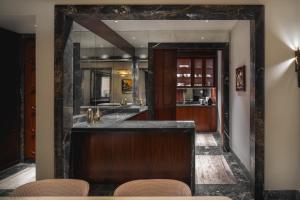 a kitchen with a bar in a room at Palazzo Ottaviani - Luxury Apartments in Florence +16 photos