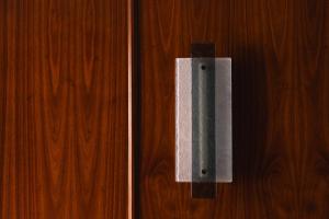 a wooden door with a metal object on it at Palazzo Ottaviani - Luxury Apartments in Florence