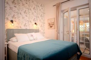 Giường trong phòng chung tại Kalina Deluxe Apartments +54 ảnh