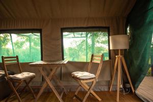 two chairs and a table in a tent at Eco Glamping Portugal Nature Lodge in São Luis +113 photos