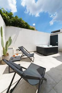 A balcony or terrace at Nara Apartments 1 - Private Jacuzzi