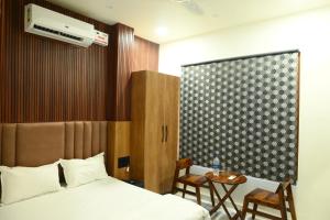 Postel nebo postele na pokoji v ubytování Hotel Tim Hartins
