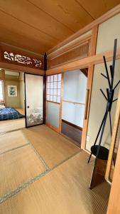 A bed or beds in a room at Kitayama Fuji View House