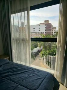 Ένα ή περισσότερα κρεβάτια σε δωμάτιο στο Siam Lucky Star Inn