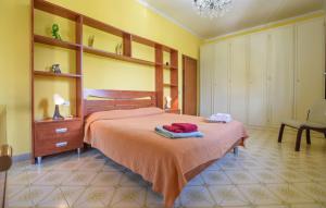 a bedroom with a bed with two towels on it at Villetta Della Pace in Lido di Camaiore