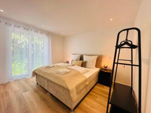 Postel nebo postele na pokoji v ubytování Bonnystay Lörrach l Balcony l Center l Design + 37 fotografií