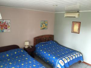 Ein Bett oder Betten in einem Zimmer der Unterkunft Hotel Vale's