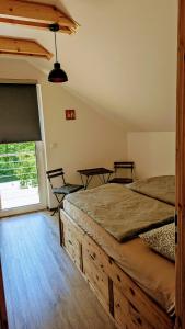 Postel nebo postele na pokoji v ubytování Vila Jedovnice