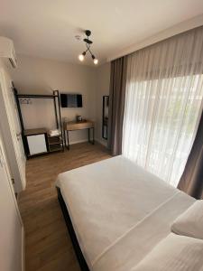 Postel nebo postele na pokoji v ubytování Sahil Butik Otel