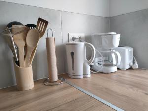 a counter with various kitchen utensils on it at Marie-Thérèse in Manspach