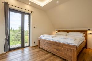 Voodi või voodid majutusasutuse SCANDIC Apartments Plešivec toas