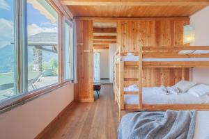 a bedroom with two bunk beds and a large window at Beautiful Dream in Perledo +67 photos