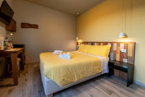 Postel nebo postele na pokoji v ubytování B&B L'Eroico