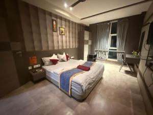 Ένα ή περισσότερα κρεβάτια σε δωμάτιο στο Stanza Luxurious Stay