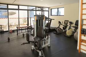 a gym with several exercise equipment in a room at Hotel Vila Mariana Bienal Suites UH 1005 in Sao Paulo