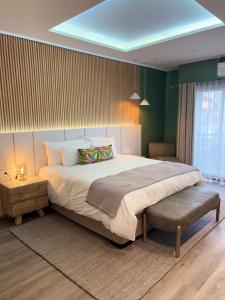 a large bedroom with a large bed and a table at Desert Diamond in Lüderitz