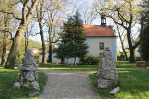 a house with a christmas tree and some rocks at U Parku in Český Krumlov
