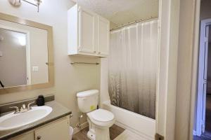 a bathroom with a toilet and a sink and a shower at Northtown Apartments 15f I Spacious 1 Bed 1 Bath in Jackson +12 photos