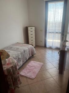 Ένα ή περισσότερα κρεβάτια σε δωμάτιο στο Casa vacanze La Gioia