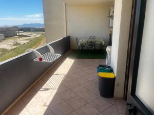 a balcony with a sink and a table in a room at Casa vacanze La Gioia in Sestu