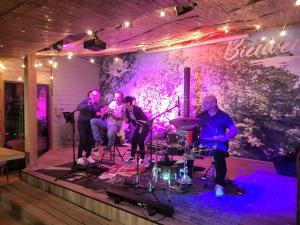 a group of people playing music on a stage at Camping Le Val de Cesse in Mirepeisset +192 photos
