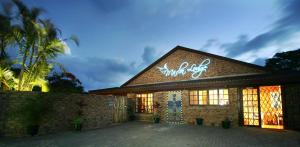 a building with a sign on the front of it at Marlin Lodge St Lucia in St Lucia
