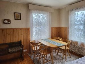 a dining room with a table and chairs at Agda's Garden in Sulkava