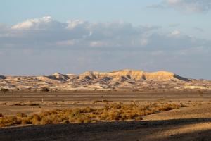 a view of a desert with mountains in the background at Desert HoM by GLOW in Naẖal Shittim