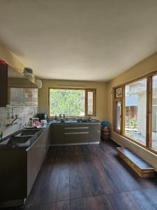 O bucătărie sau chicinetă la Apple Inn Wandervale Cottage