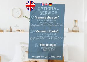 a sign for an online service with the uk flag at Appart'Hôtel & Spa "Les Voiles" Belle Île en Mer in Carnac